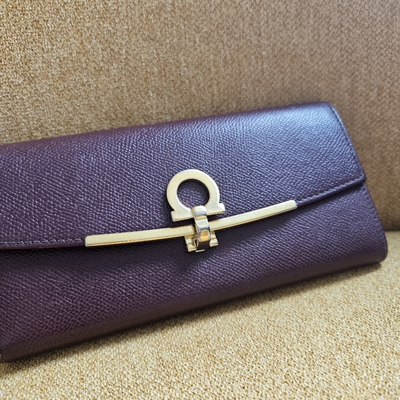 Authentic Salvatore Ferragamo WOC. Merlot Color With Gold Hardware.